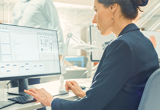 Woman typing on keyboard